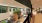 woman looks over balcony to ground floor lobby